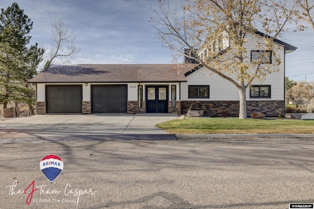 view of front of house with a front lawn and a garage