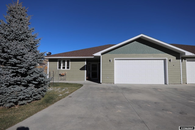 ranch-style home featuring a garage