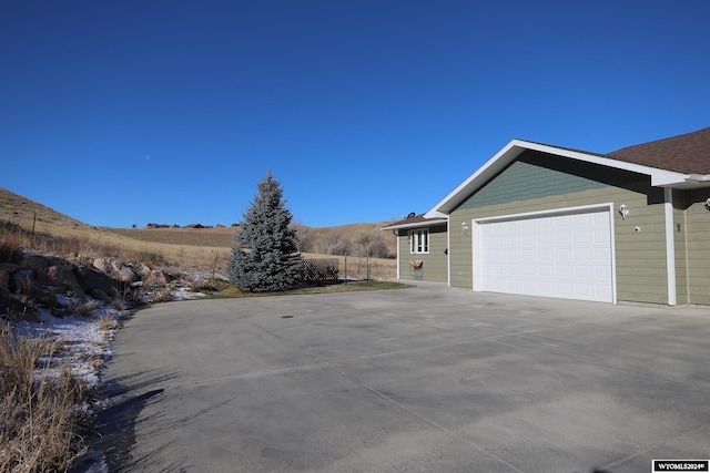 view of side of property with a garage