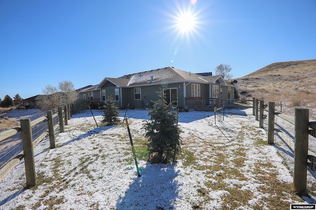 view of snow covered house