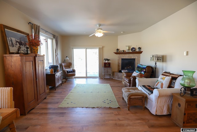 living room with hardwood / wood-style flooring and ceiling fan