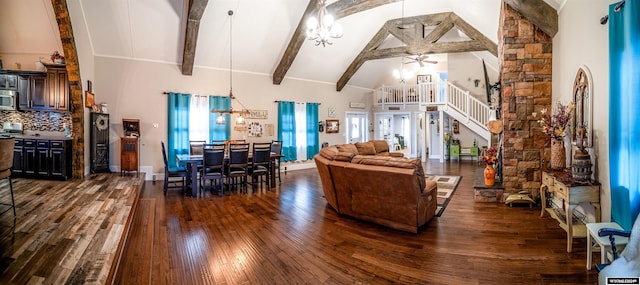 living room featuring beamed ceiling, ceiling fan with notable chandelier, dark hardwood / wood-style floors, and high vaulted ceiling