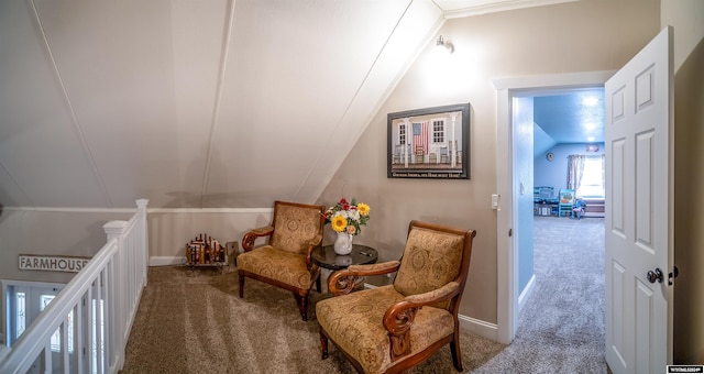 interior space featuring carpet floors, crown molding, and vaulted ceiling