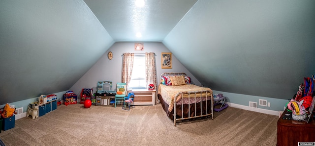 bedroom with carpet floors and lofted ceiling