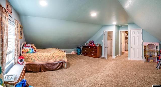 carpeted bedroom featuring vaulted ceiling