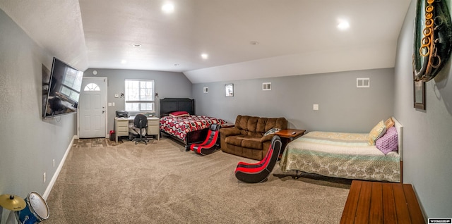 carpeted bedroom with vaulted ceiling