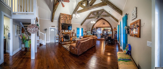 living room featuring ceiling fan, hardwood / wood-style floors, high vaulted ceiling, and beamed ceiling