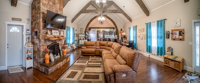 living room with beamed ceiling, dark hardwood / wood-style floors, ceiling fan, and plenty of natural light