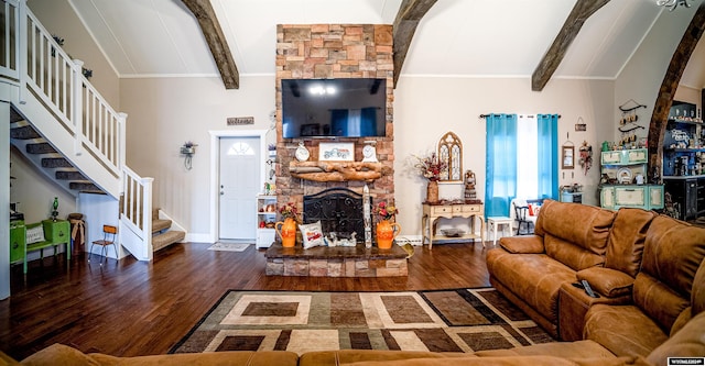 living room featuring a fireplace, lofted ceiling with beams, and dark wood-type flooring