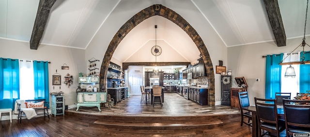 dining room with vaulted ceiling with beams, dark hardwood / wood-style floors, and a notable chandelier