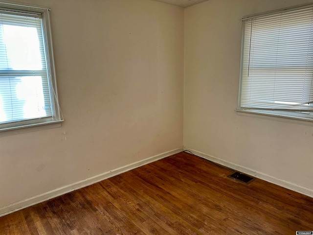 spare room with hardwood / wood-style flooring