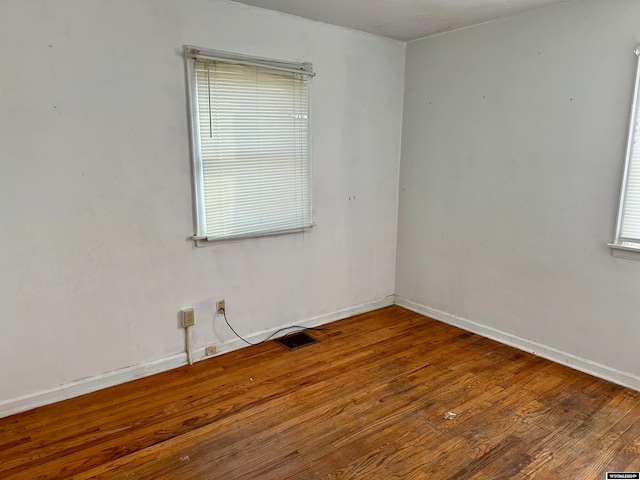 empty room featuring wood-type flooring