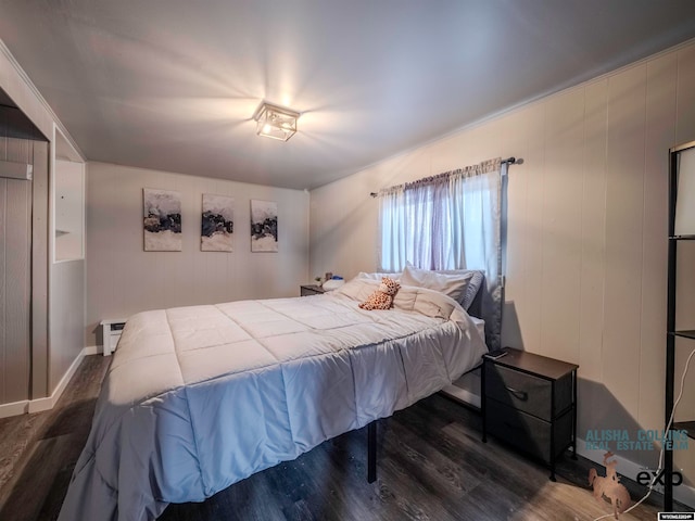 bedroom featuring dark hardwood / wood-style floors