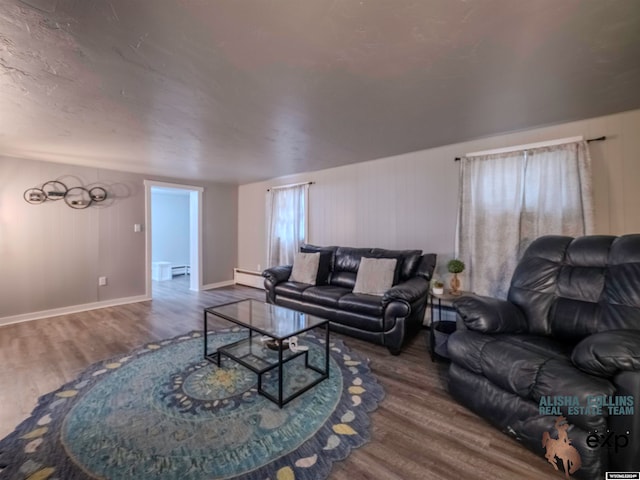 living room featuring hardwood / wood-style floors and a baseboard radiator