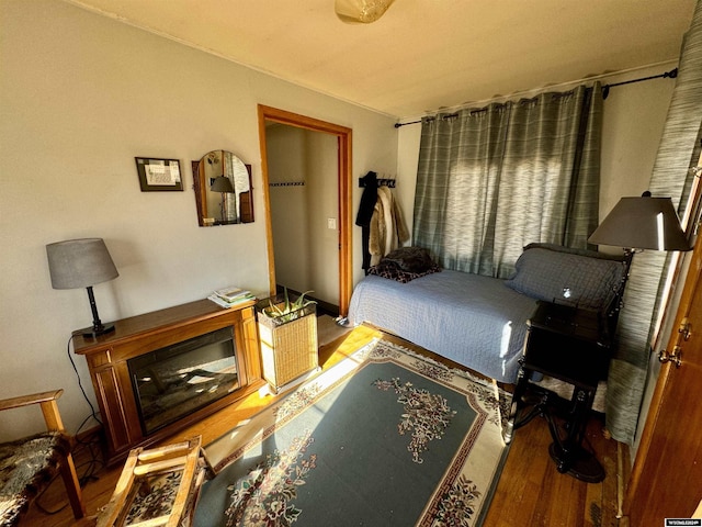 bedroom with wood-type flooring