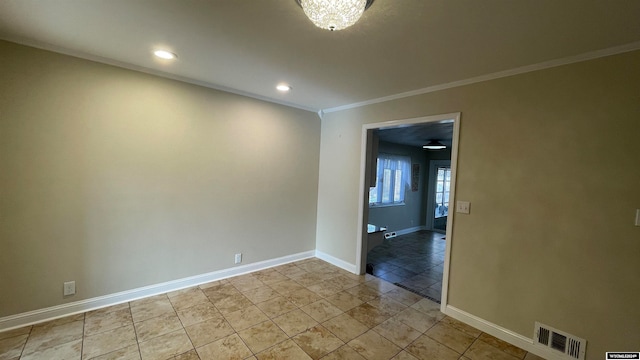 unfurnished room featuring ornamental molding