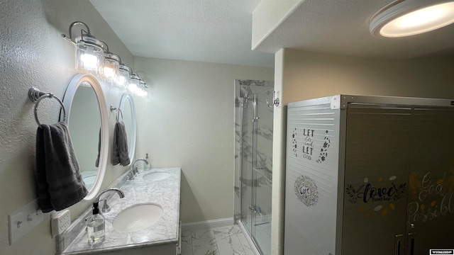 bathroom featuring vanity and a shower with shower door