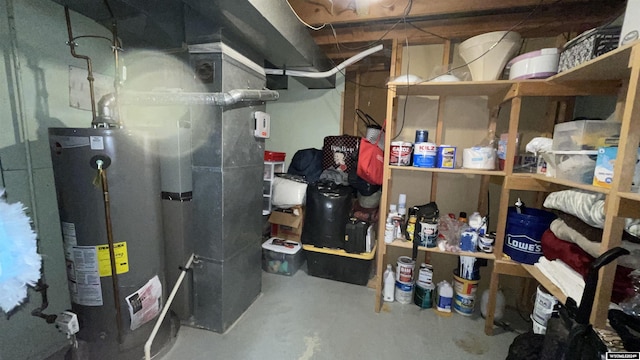 utility room with gas water heater and heating unit