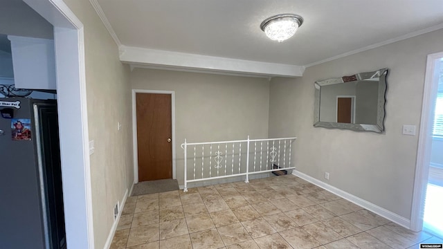 empty room featuring crown molding