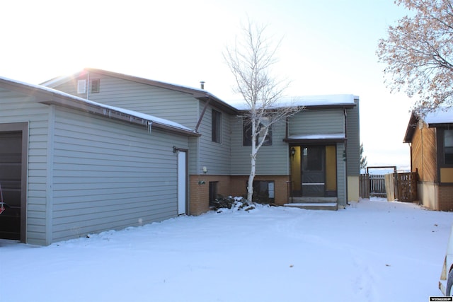 view of snow covered house