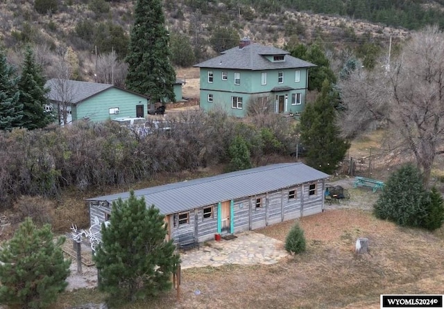 view of front of house with an outbuilding