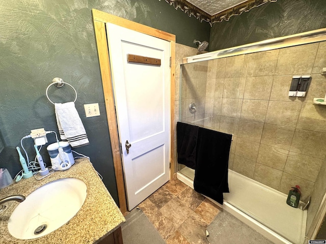 bathroom featuring sink and tiled shower