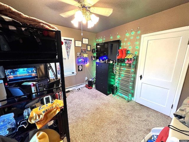 carpeted bedroom with ceiling fan and a textured ceiling