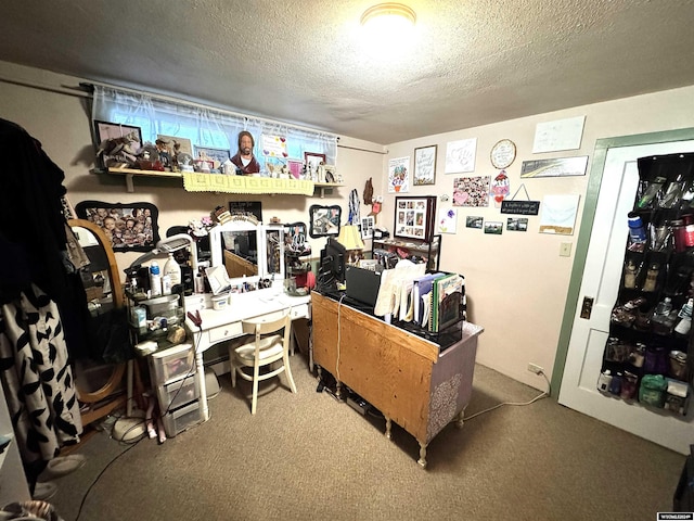 home office featuring carpet flooring and a textured ceiling