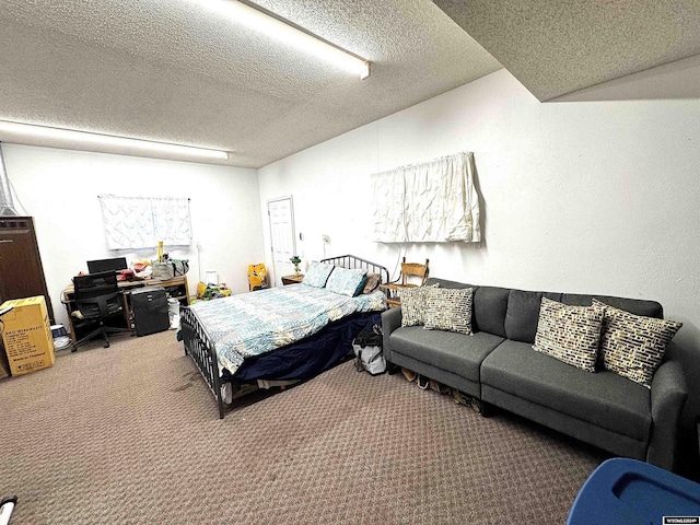 carpeted bedroom featuring a textured ceiling