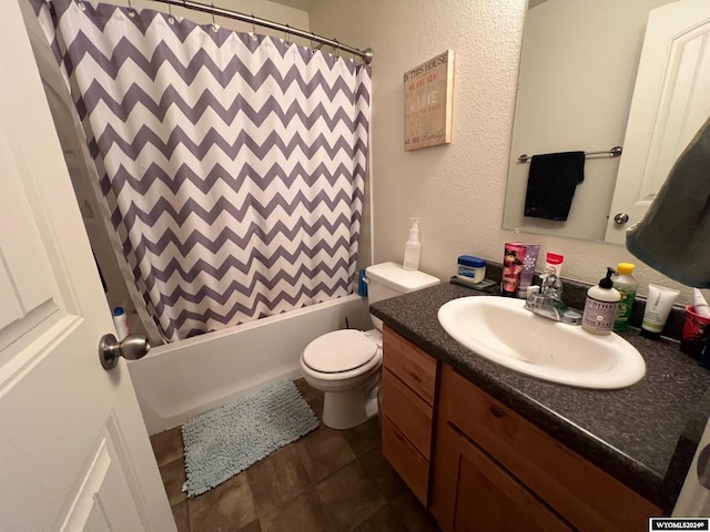 full bathroom featuring tile patterned floors, shower / bath combo, toilet, and vanity