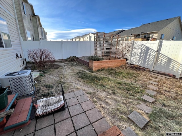 view of yard with central air condition unit