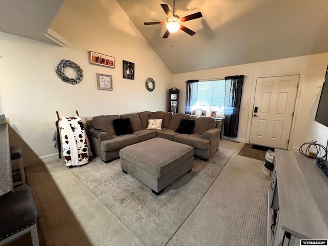 carpeted living room with ceiling fan and high vaulted ceiling