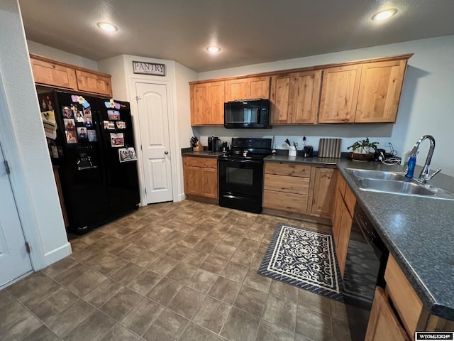 kitchen with sink and black appliances