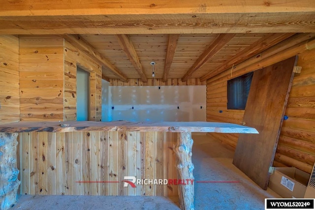 bar featuring beam ceiling and wooden ceiling