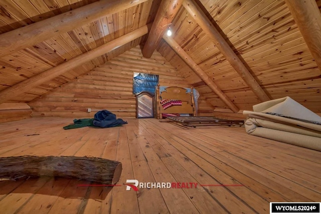 additional living space with vaulted ceiling with beams, wooden ceiling, wood-type flooring, and wood walls