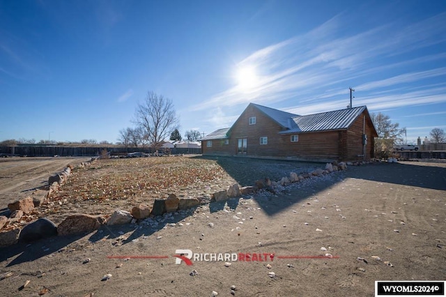 311 Bridge Ave, Worland, WY 82401 - view of side of property featuring a metal roof