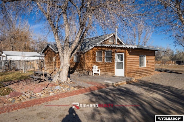323 Bridge Ave, Worland, WY 82401 - view of front facade featuring log veneer siding