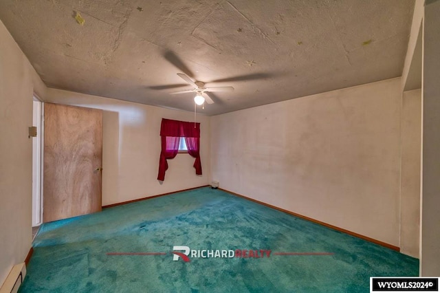 323 Bridge Ave, Worland, WY 82401 - unfurnished room with a baseboard radiator, ceiling fan, and carpet floors
