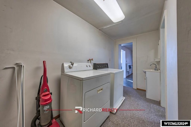 laundry area with independent washer and dryer