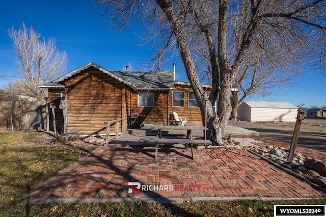 rear view of house featuring a patio