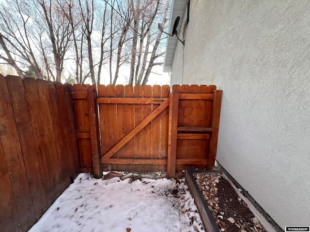 view of snow covered gate