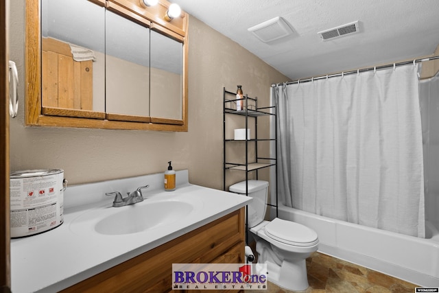 full bathroom featuring shower / tub combo, vanity, a textured ceiling, and toilet