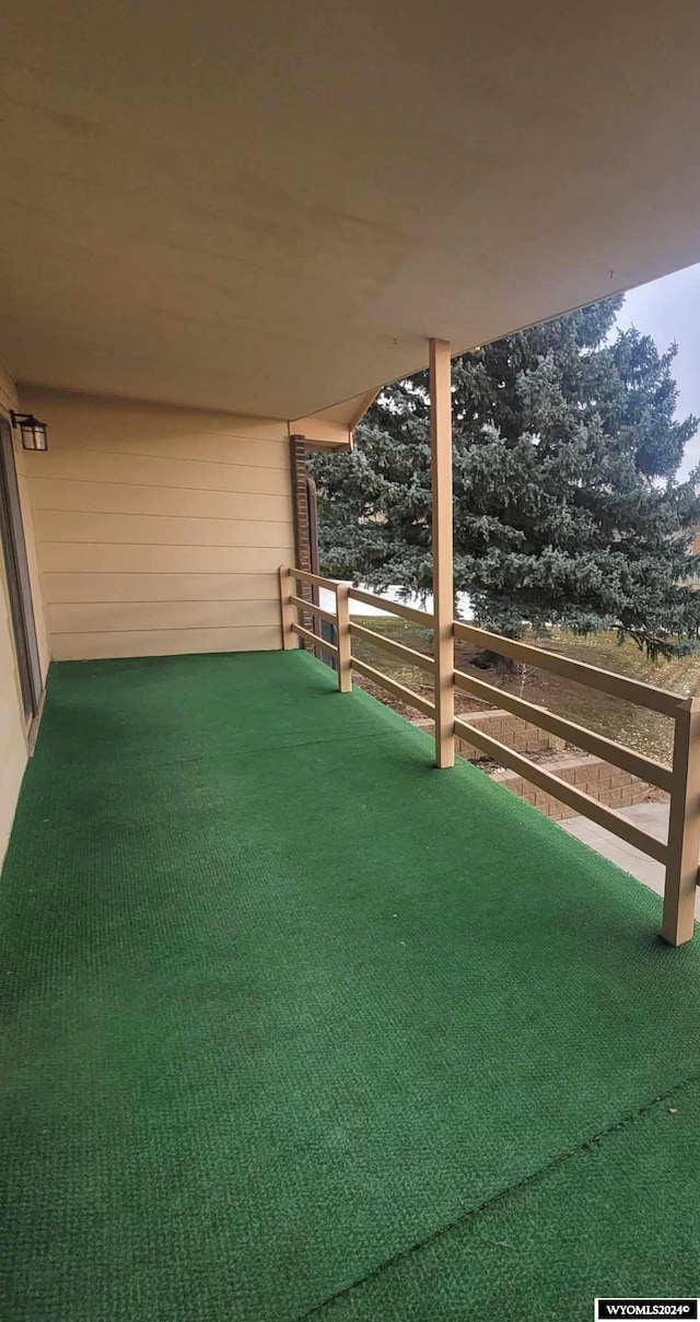 view of yard featuring a balcony