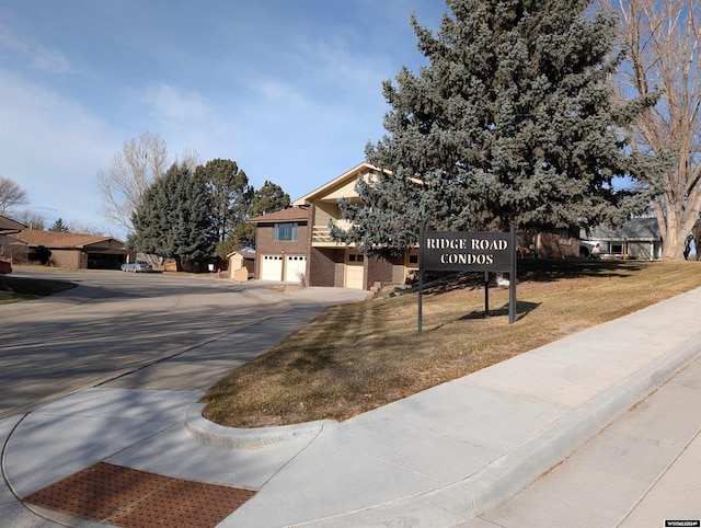 view of front of property with a garage and a front yard