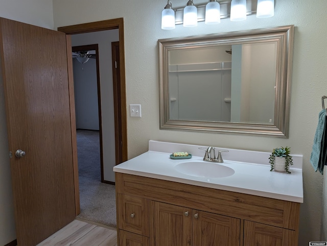 bathroom with vanity and hardwood / wood-style flooring