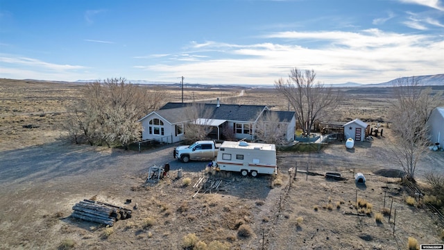 drone / aerial view featuring a mountain view