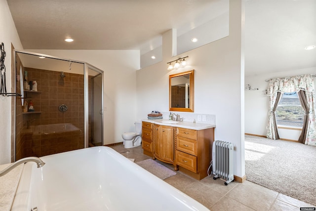 bathroom featuring radiator, vanity, tile patterned flooring, toilet, and lofted ceiling