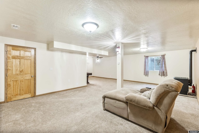 living room featuring carpet floors and a textured ceiling