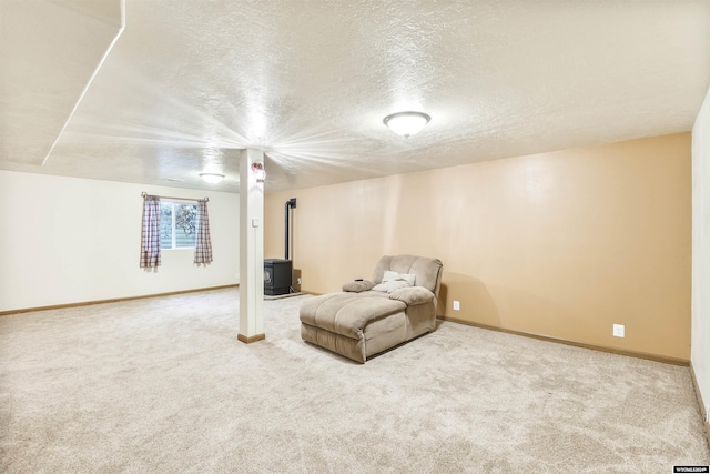 basement with carpet flooring and a textured ceiling