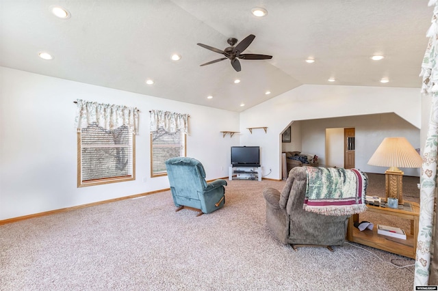 carpeted living room featuring ceiling fan and lofted ceiling